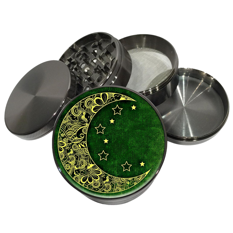 Grey herb grinder with a yellow crescent moon and stars on a green lid, shown with its sections apart