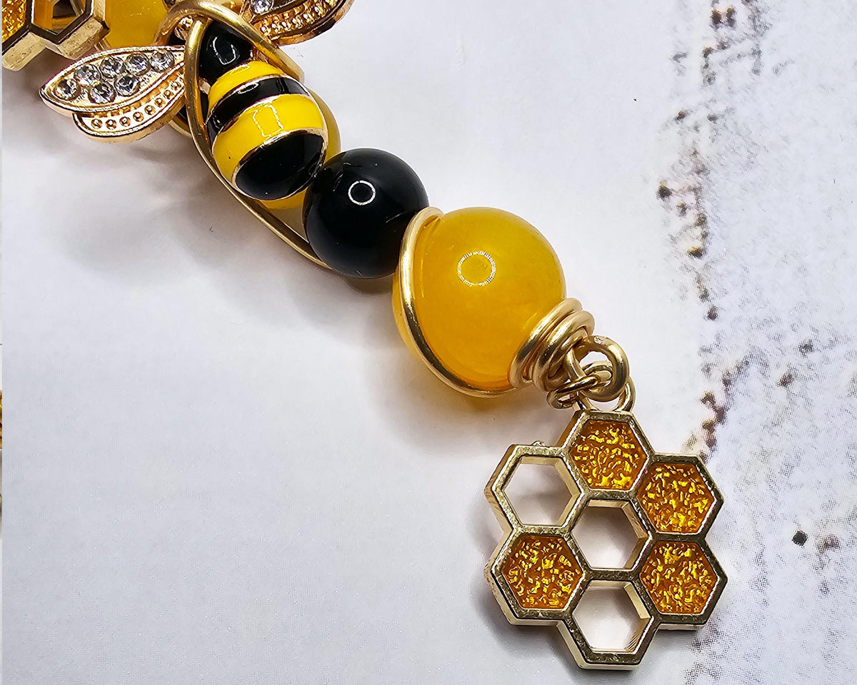 Honey bee wand cigarette holder bee and honeycomb charm close-up