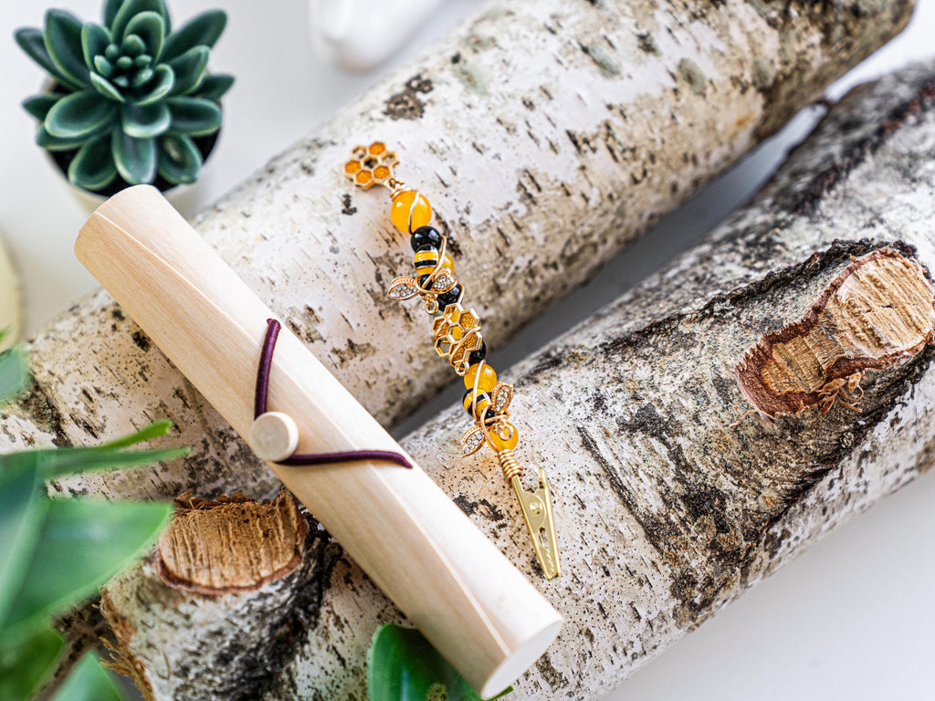 Honey bee wand cigarette holder beside a bamboo case