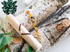 Honey bee wand cigarette holder beside a bamboo case