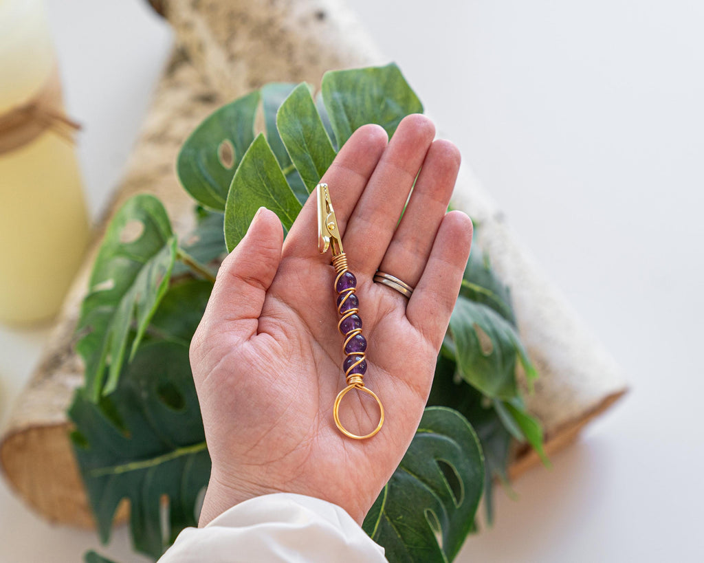 Gold-tone purple beaded wand cigarette holder close-up
