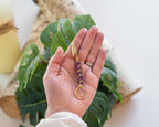 Gold-tone purple beaded wand cigarette holder close-up