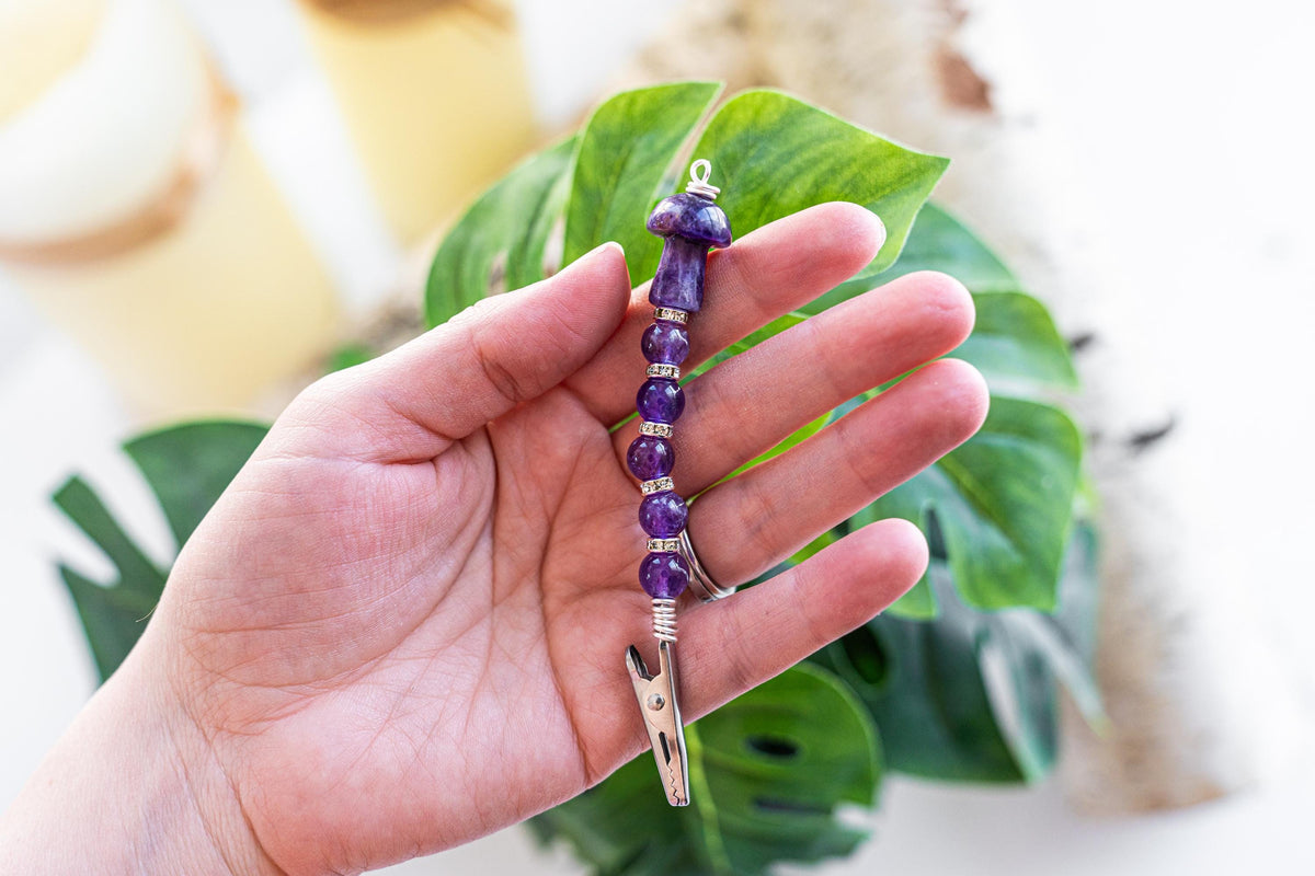Purple mushroom beaded wand cigarette holder shown in hand