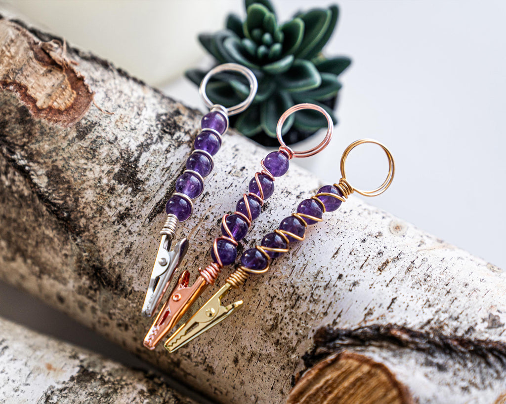 Purple beaded wand cigarette holder finish options on a birch display