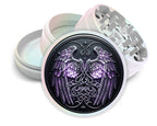 Celestial wings and knotwork crest design on pearl white herb grinder with open product view