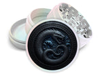 Runic sea serpent emblem design on pearl white herb grinder with open product view
