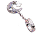 Silver-tone moon and star cigarette holder ring held in hand