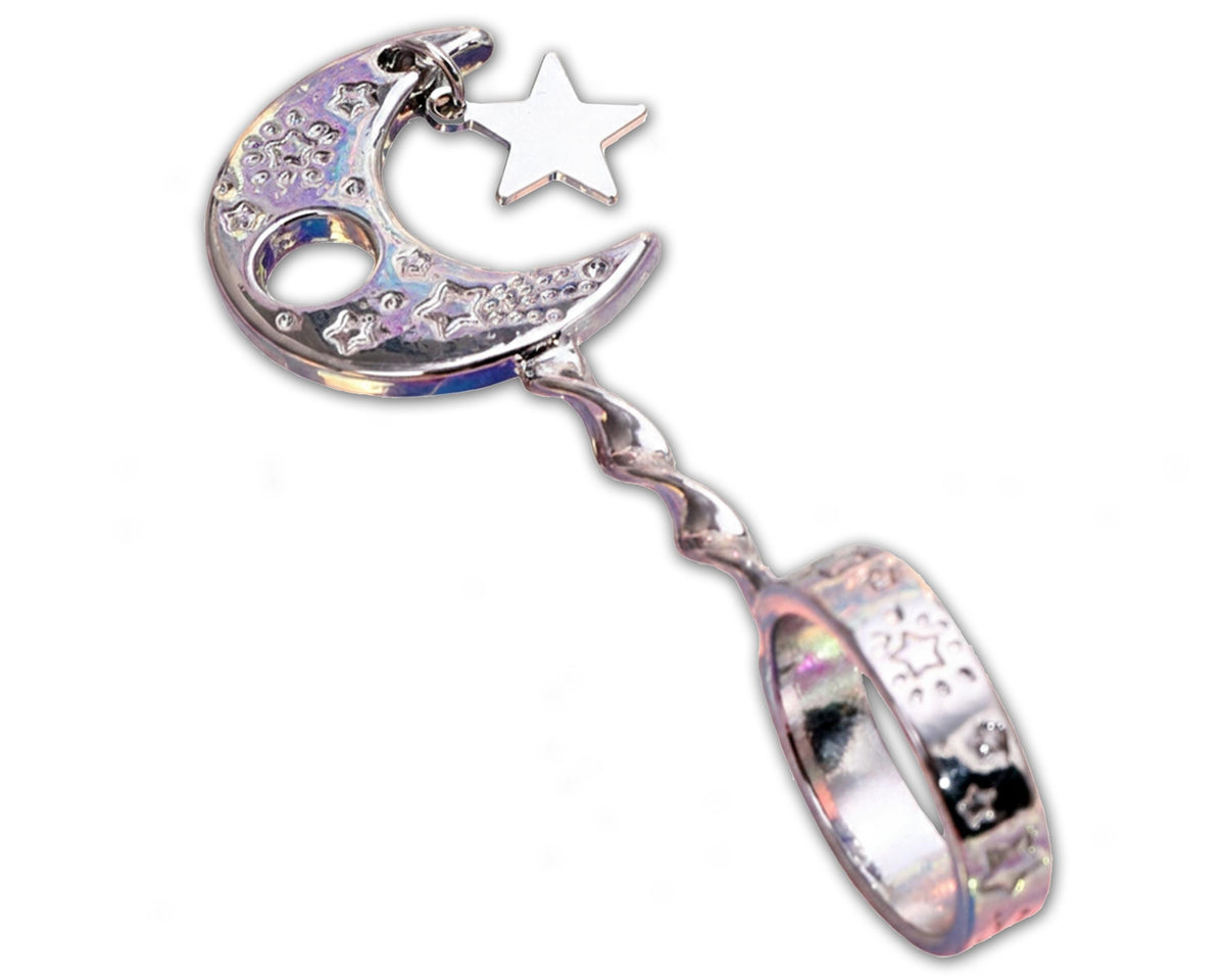 Silver-tone moon and star cigarette holder ring held in hand