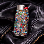 Rainbow rhinestone-style lighter case shown in a black pocket