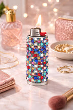 Rainbow rhinestone-style lighter case shown fitted over a lighter