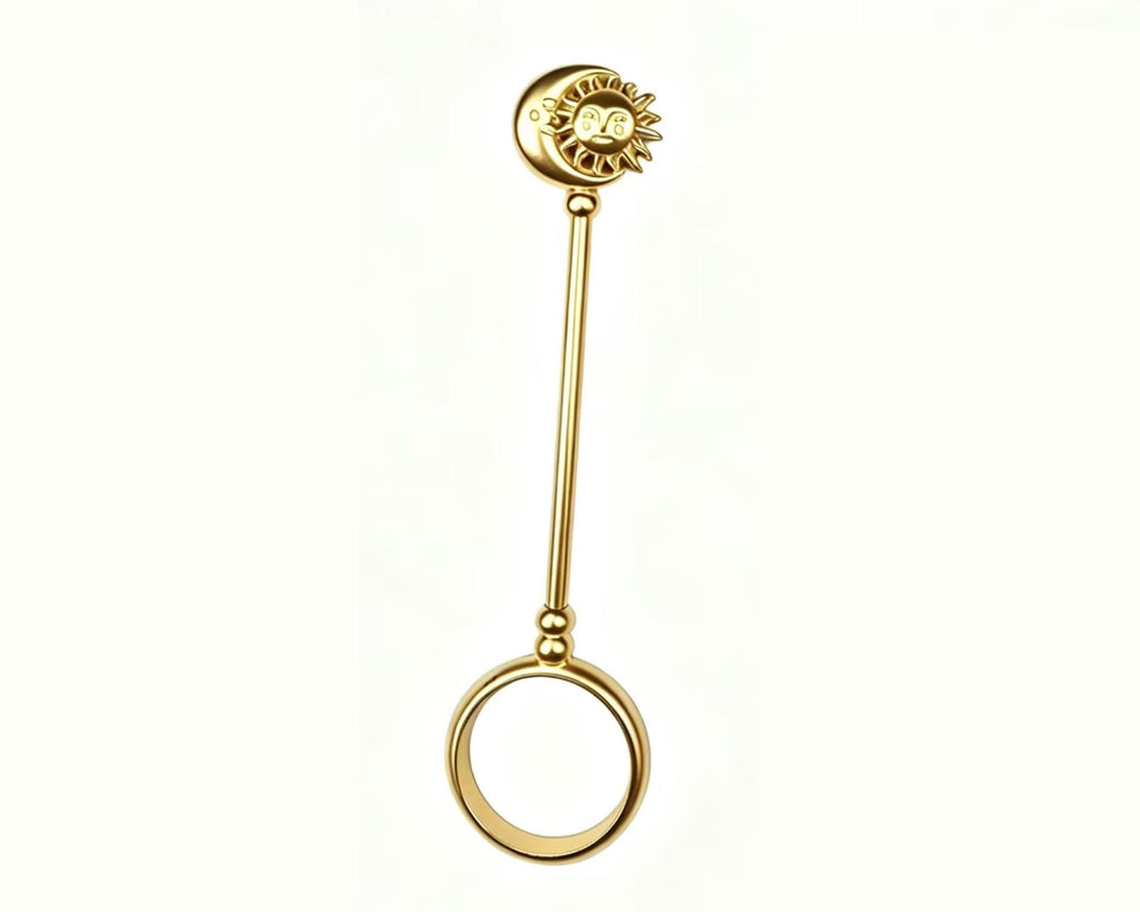 Full-length gold-tone sun and moon cigarette holder ring on a white background