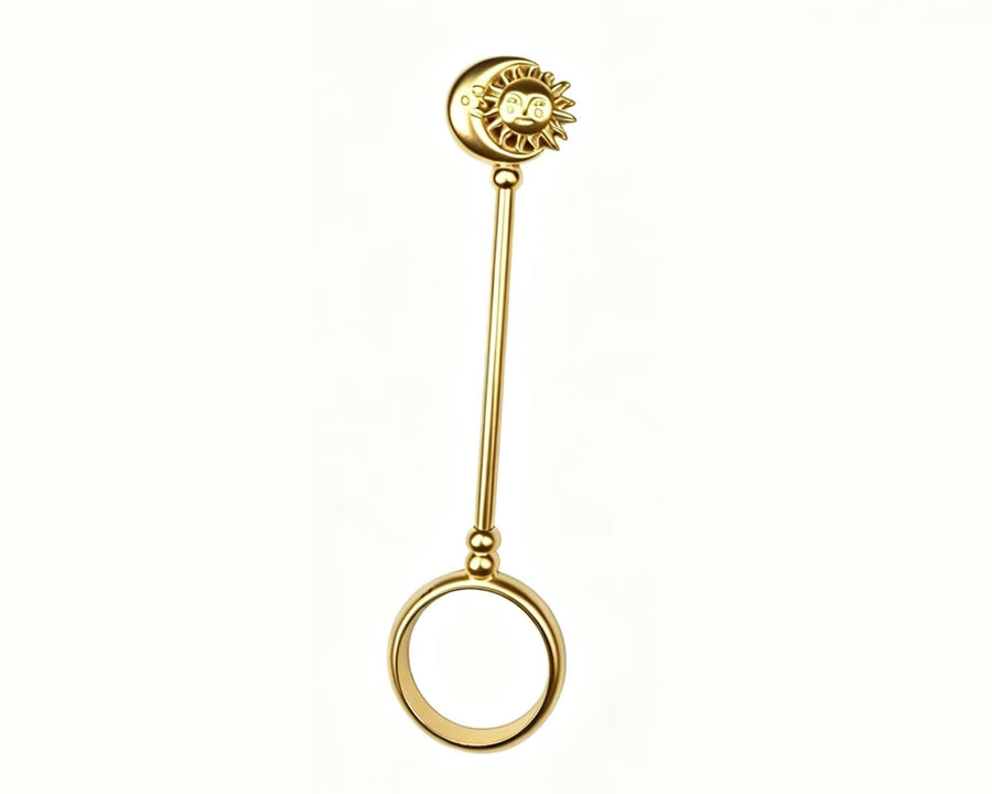Full-length gold-tone sun and moon cigarette holder ring on a white background