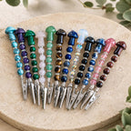 Mushroom beaded wand cigarette holders arranged by color