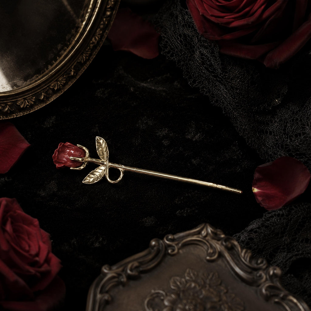 Gold rose cigarette holder with leaf detail close-up