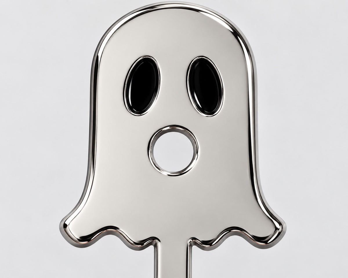 Silver-tone ghost face cigarette holder close-up