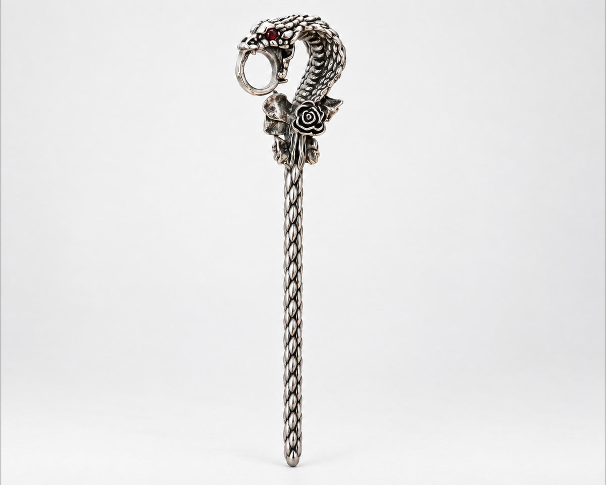 Full-length silver-tone snake cigarette holder on white