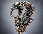 Green-eye silver-tone snake cigarette holder close-up