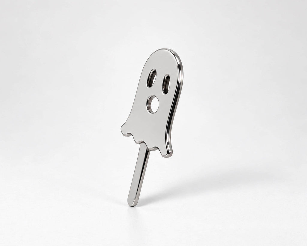 Angled view of silver-tone ghost cigarette holder