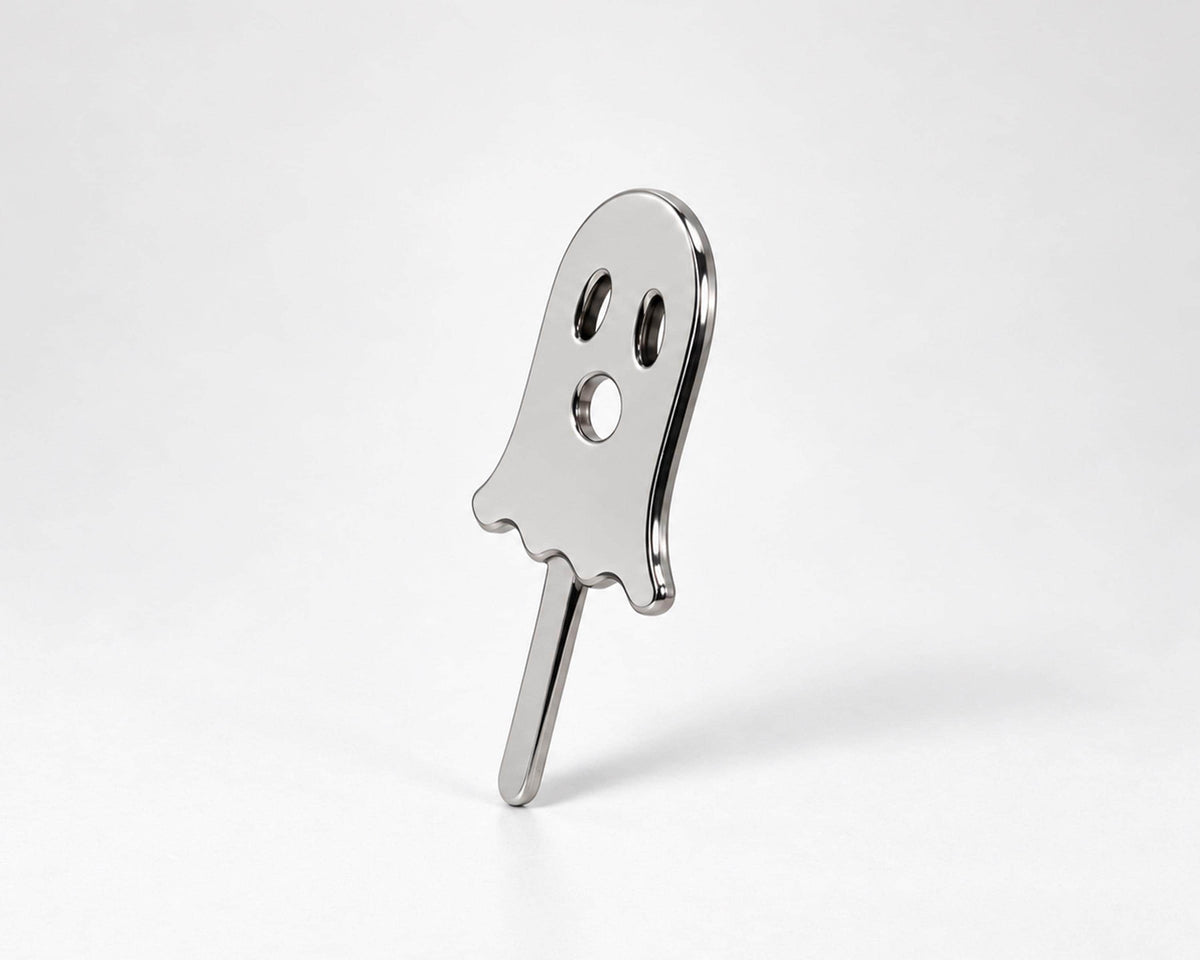 Angled view of silver-tone ghost cigarette holder