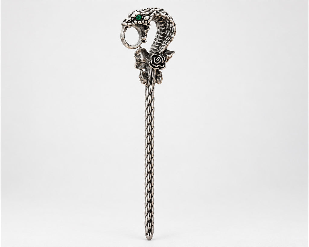Silver-tone snake cigarette holder side view on white