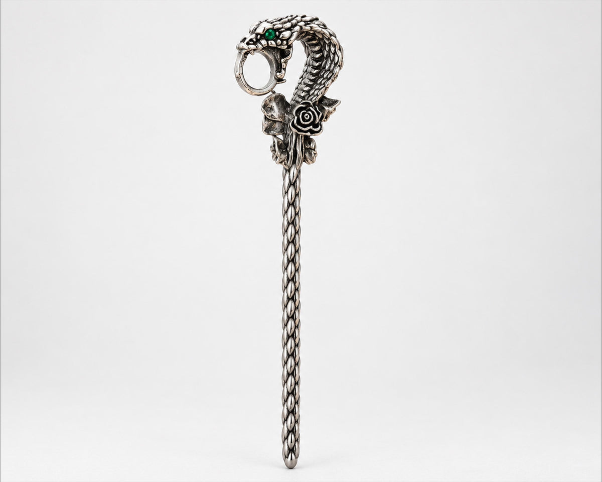 Silver-tone snake cigarette holder side view on white